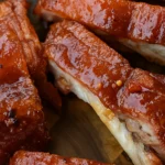 How to Cook Perfect Chicken on a Pellet Grill: The Ultimate Guide 13 Juicy chicken with crispy skin cooked on a pellet grill with smoke rising